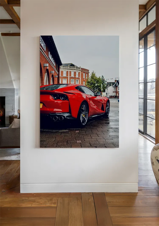 Red sports car canvas painting above the bed in the bedroom