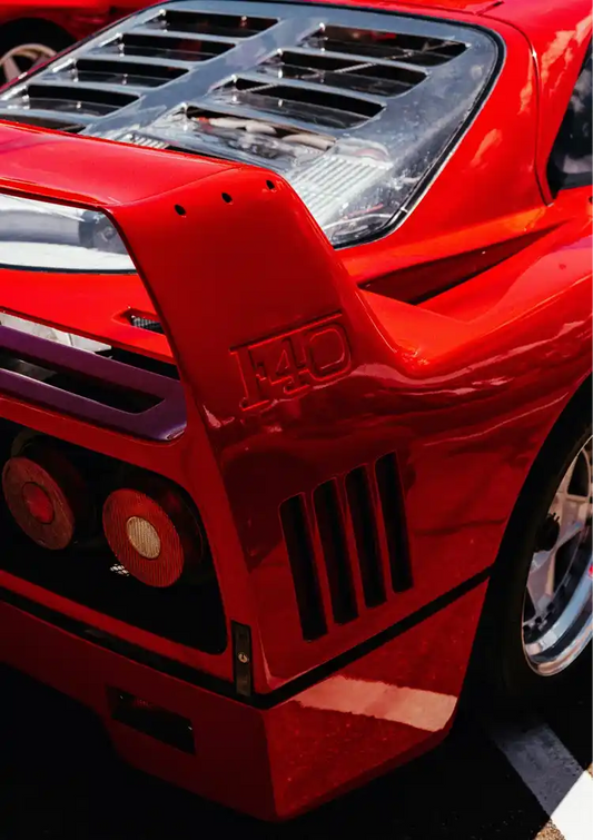 Red sports car canvas painting in red and black, with sharp details of the rear