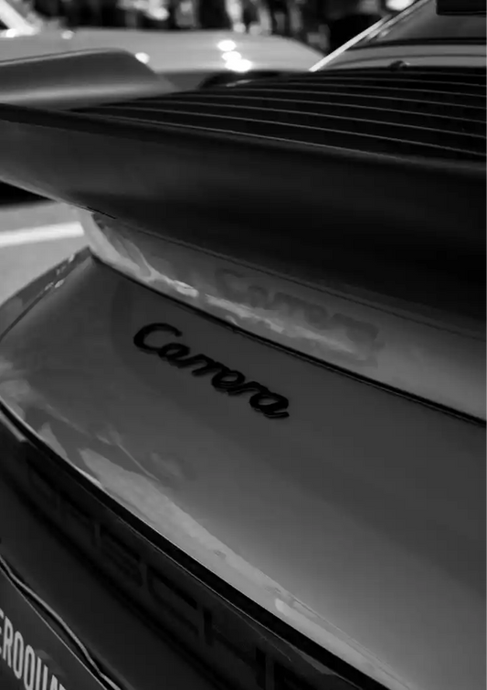 Sports car emblem canvas painting in close-up, captured in black and white
