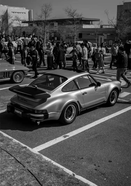 Silver sports car canvas painting at a car show in black and white