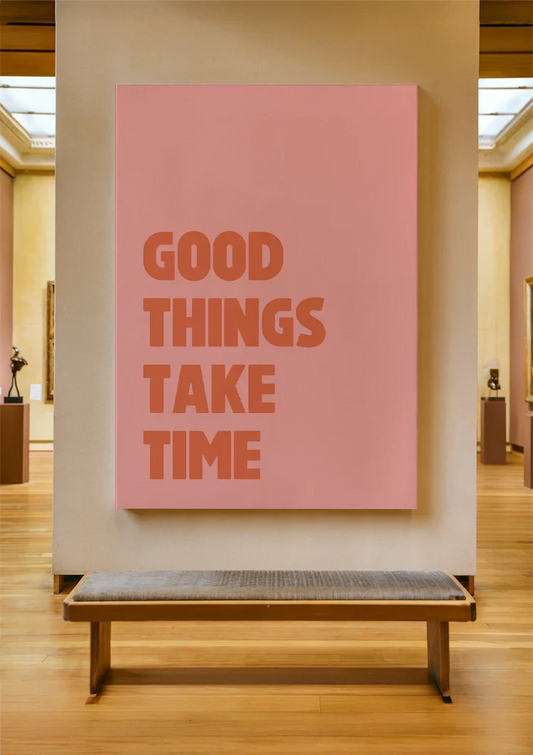Good things take time canvas painting on the wall above the bed in the bedroom.
