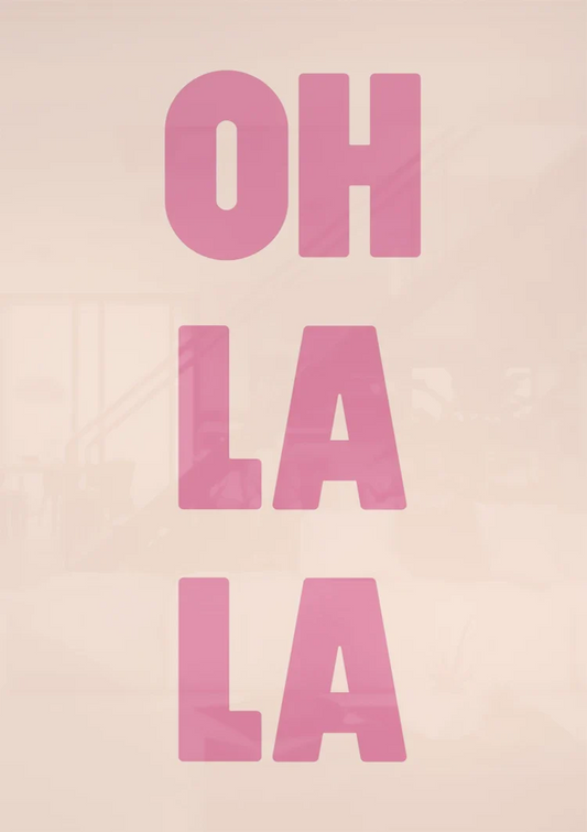 Oh la la text canvas painting on the wall above the sofa in the bedroom