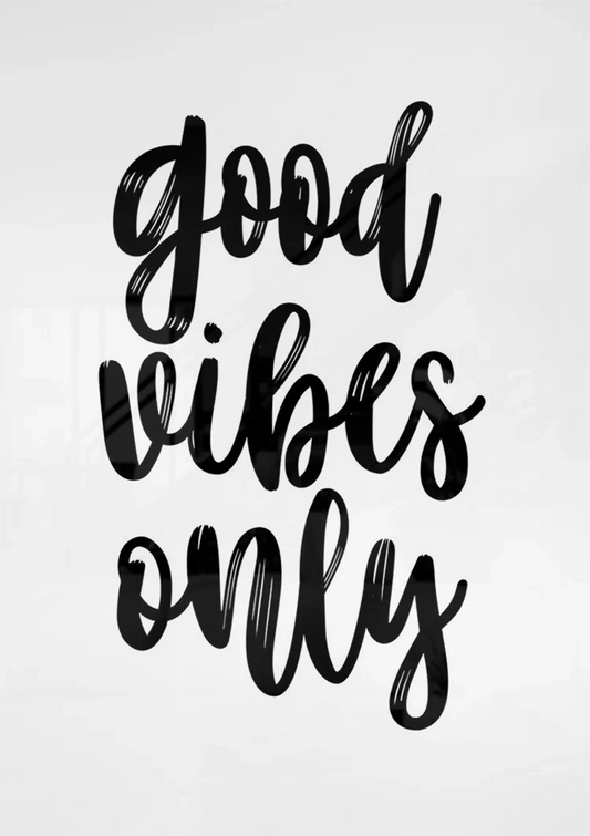 Good vibes only text canvas painting on the wall above the sofa in the bedroom