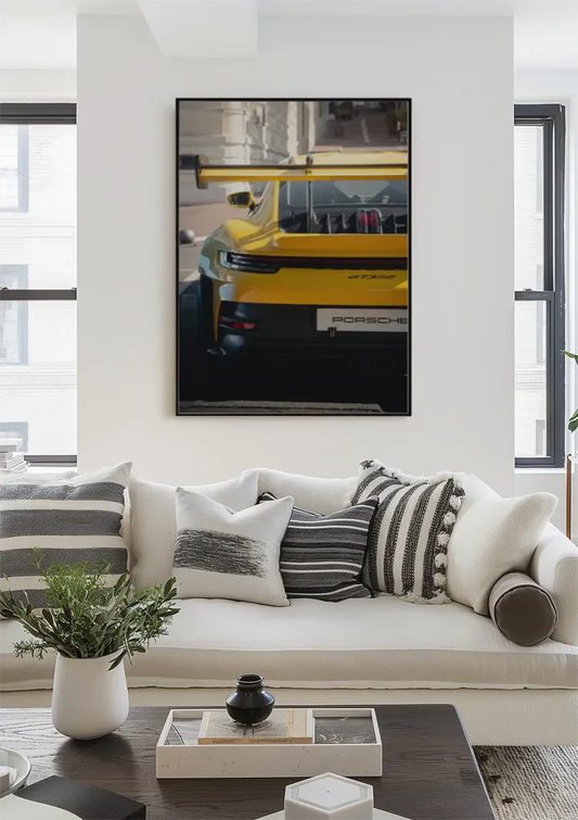 Yellow sports car from behind canvas painting above the bed in the bedroom