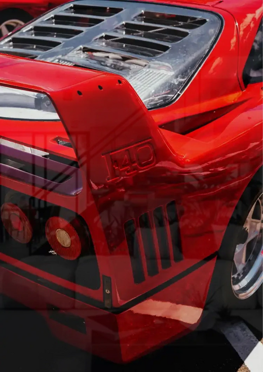 Red sports car canvas painting on the wall above the sofa in the bedroom