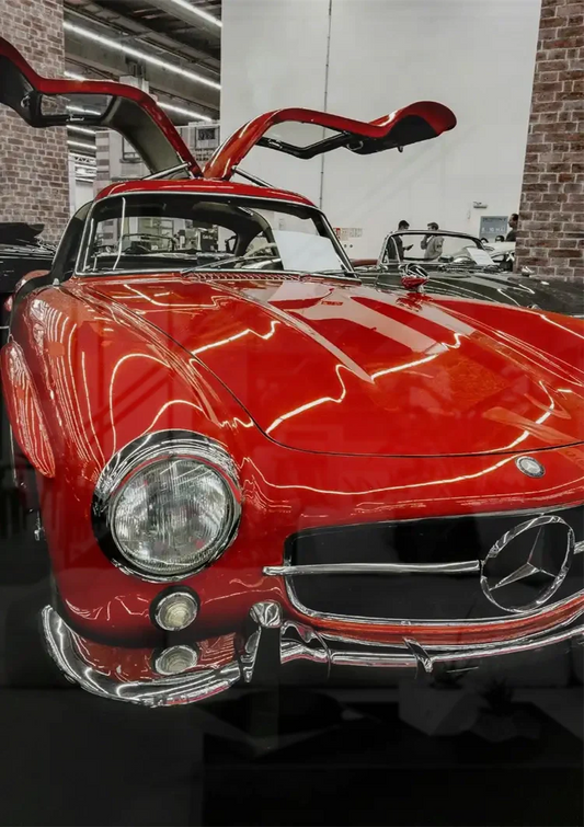 Red sports car canvas painting on the wall above the bed in the bedroom