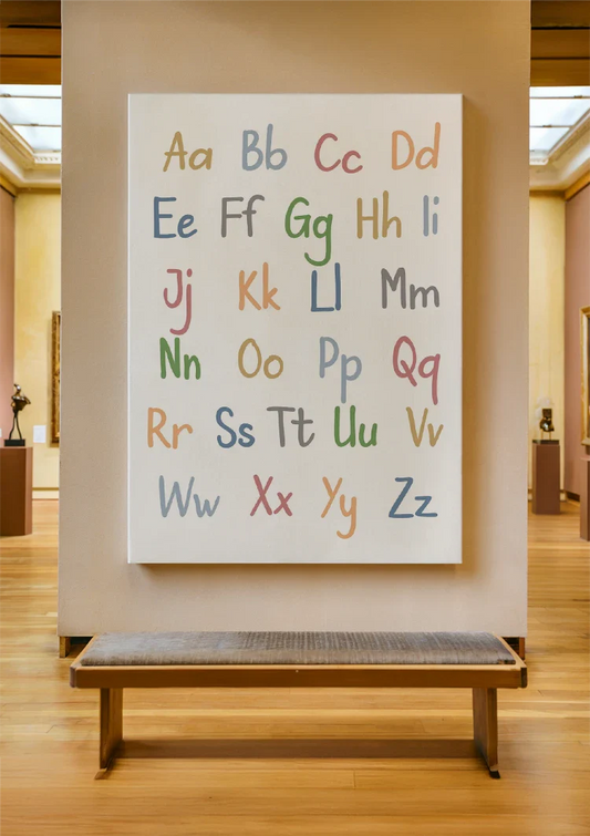Pastel alphabet canvas painting on the wall above the bed in the bedroom.