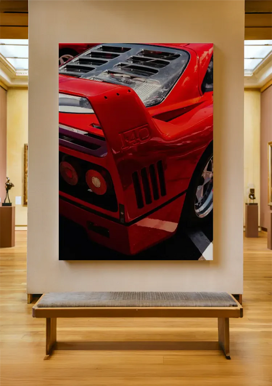 Red sports car canvas painting on the wall above the sofa in the hallway