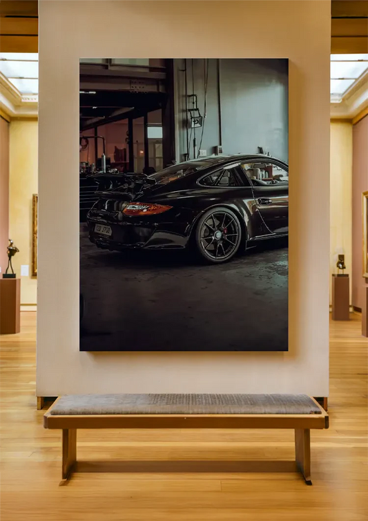 Black sports car canvas painting on the wall by the front door in the hallway