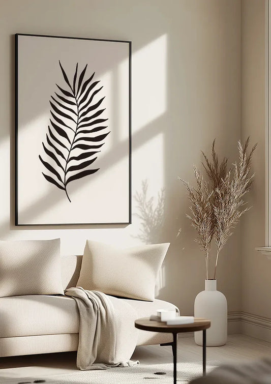 Zwart palmblad canvas schilderij aan de muur in de hal