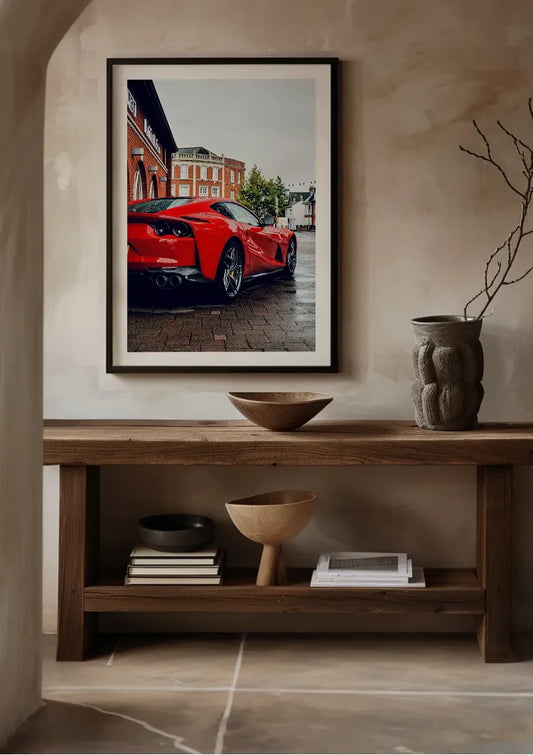 Red sports car canvas painting by the front door in the hallway