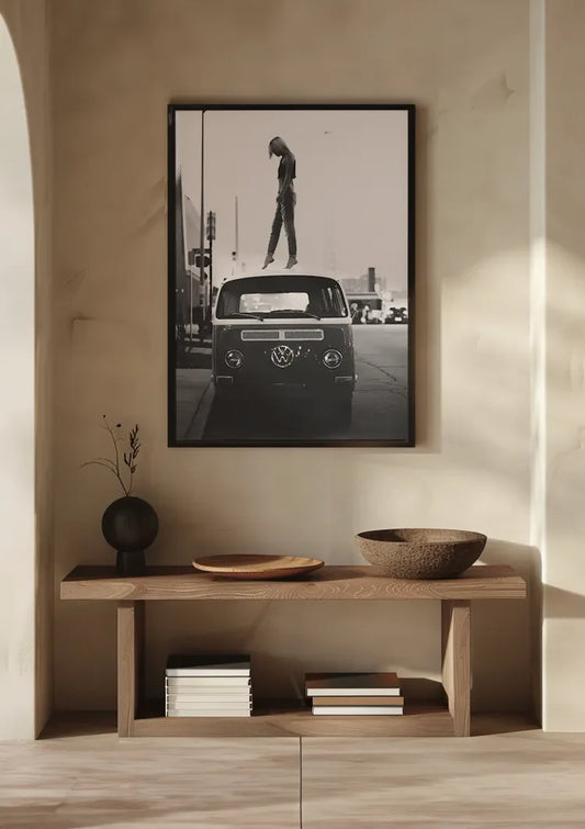 Camper van with person on roof canvas painting on the wall in the hallway