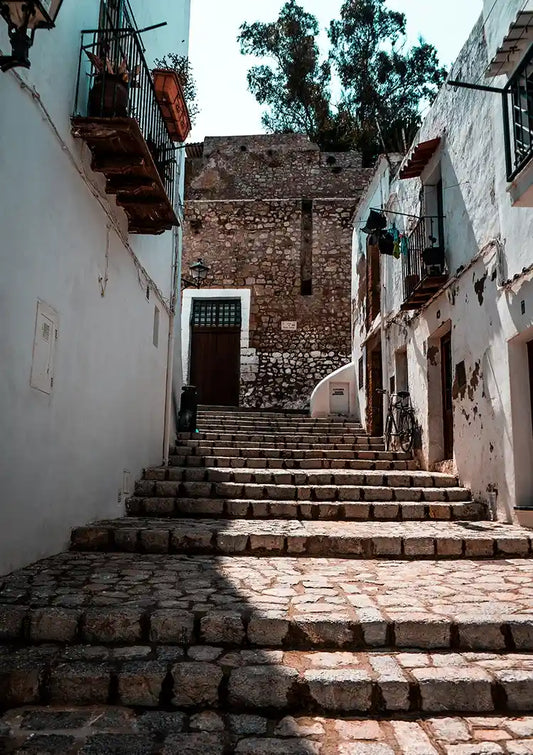 Old Cobblestone Stairs between White Mediterranean Buildings Canvas Print