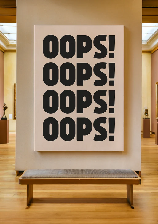 Oops text canvas painting on the wall above the sofa in the hallway