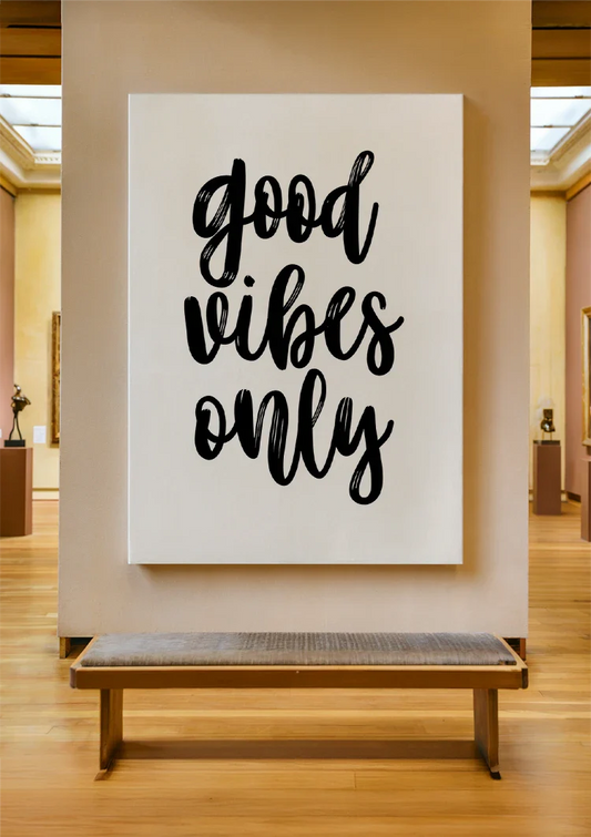 Good vibes only text canvas painting on the wall above the sofa in the hallway