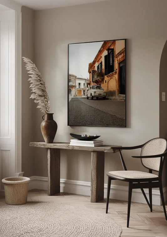 White vintage car canvas painting on the wall above the bed in the bedroom