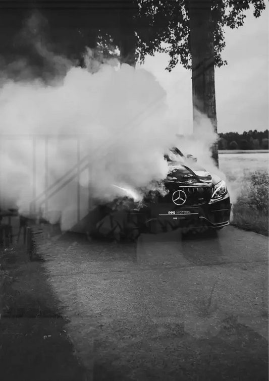 Sports car burnout with smoke canvas painting above the bed in the bedroom.