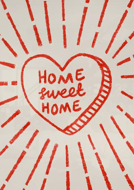 Home sweet home met een hart canvas schilderij aan de muur boven het bed in de slaapkamer