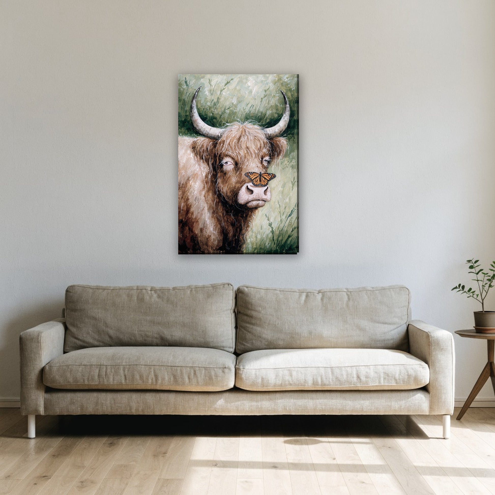 Highland cow with butterfly canvas painting on the wall above the sofa in the living room