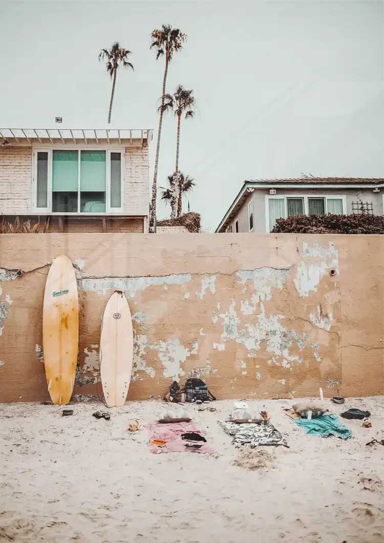 Surfboards Against Wall On Beach With Palm Trees Painting