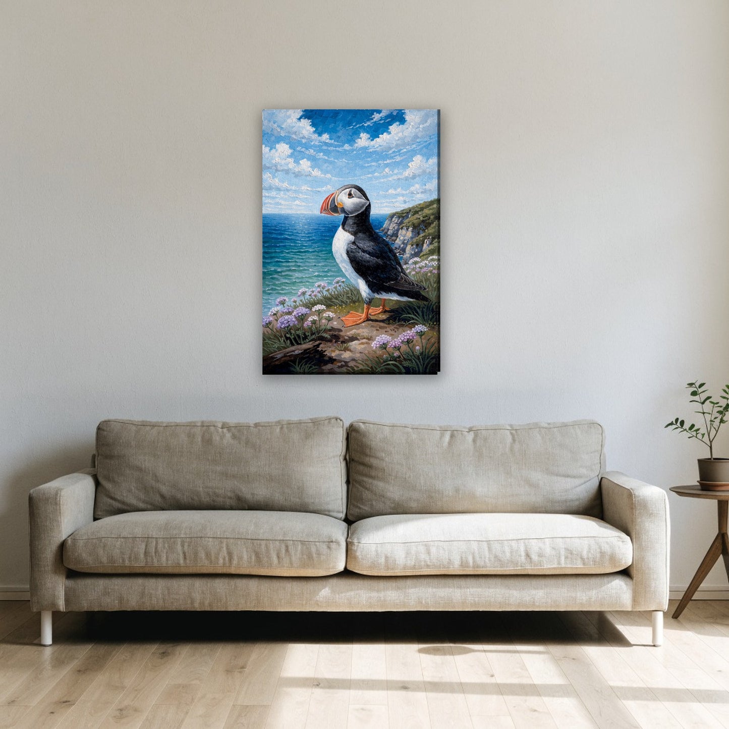Papegaaiduiker aan de kust canvas schilderij aan de muur boven de bank in de woonkamer