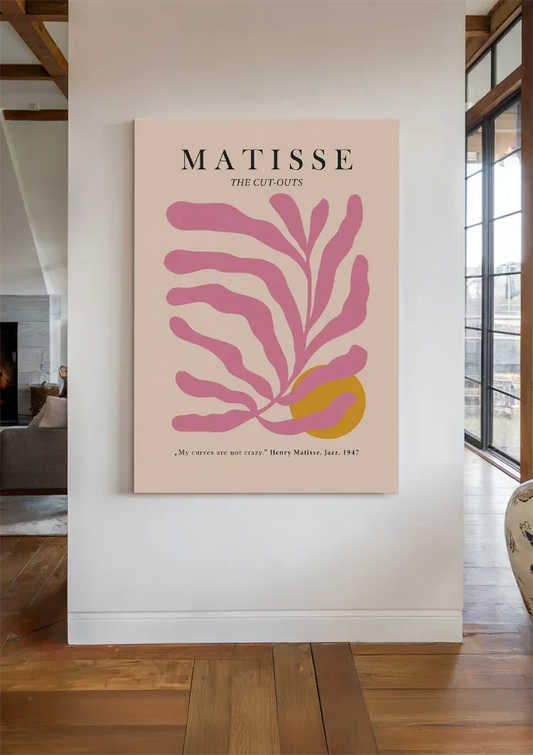 Matisse bladmotief canvas schilderij hangt boven het bed in de slaapkamer
